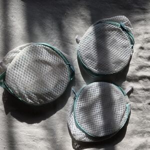 White Mesh Laundry Bags with Green Trim